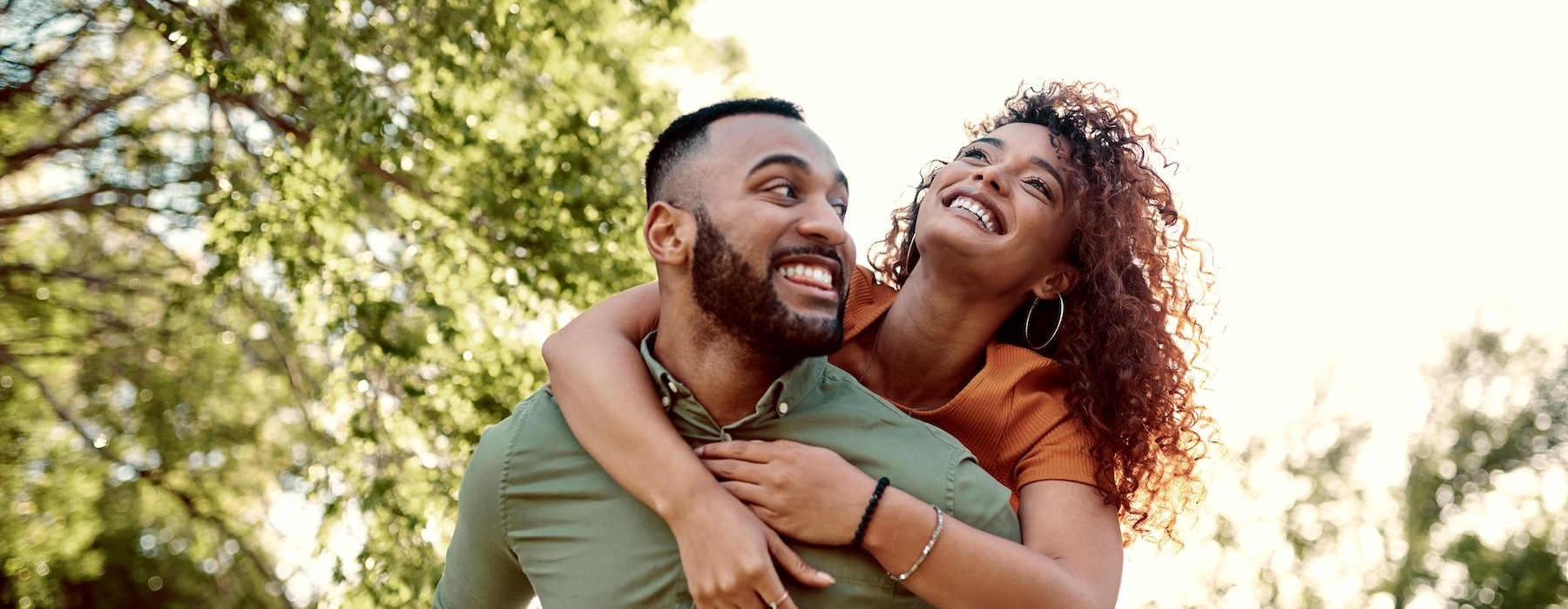 a man giving a woman a piggy back ride